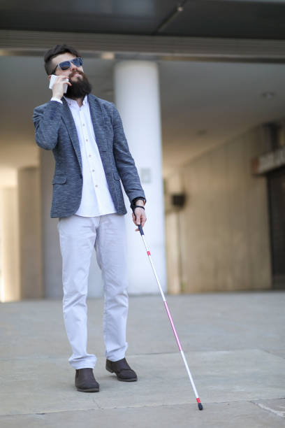 istock Young beautiful bearded man with walking sticks on the street 1152605823