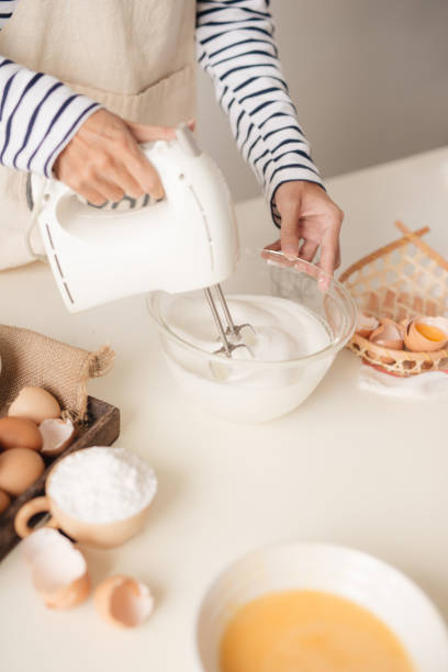 istock Kitchen mixer whipped cream custard pastry whisk rotates rapidly 1152609541