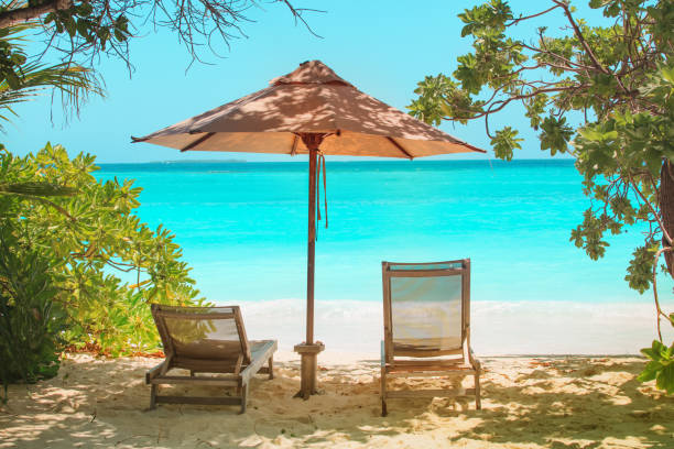 istock Two beach chairs on tropical vacation at sea 1152609684