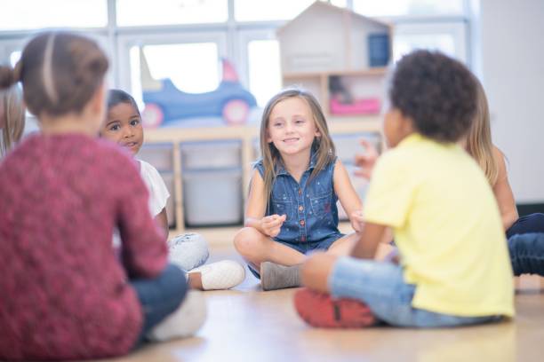 istock Kids Chatting At School 1152612435