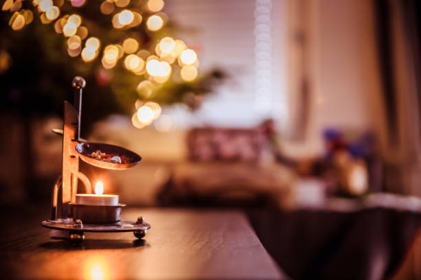 istock Christmas time: Candle with incense, Christmas tree and presents 1152612452