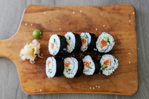 istock Top down view of maki sushi on a cutting board 1152612722