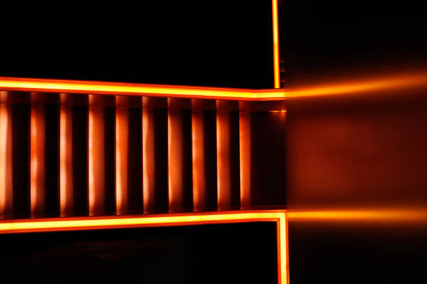 istock Stairway with orange and yellow lights along steps creating a vector illustration 1152613336
