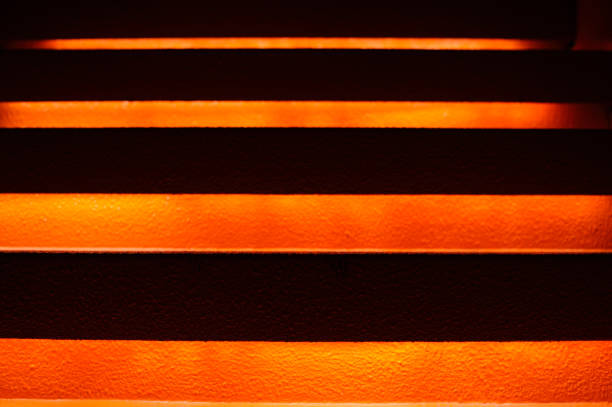 istock Stairway with orange and yellow lights along steps creating a vector illustration 1152613845