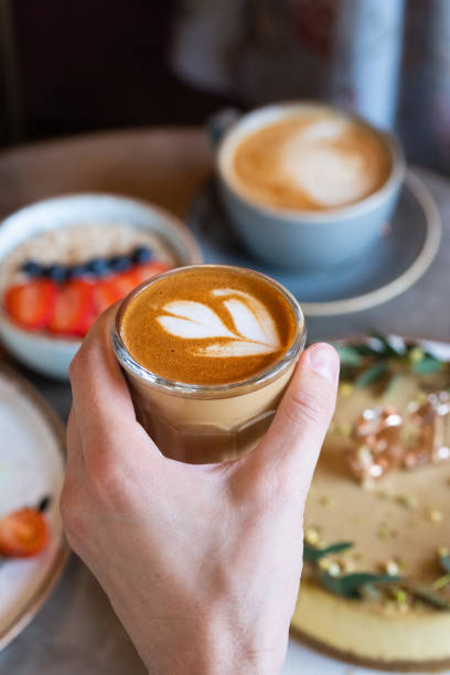istock Flat white coffee in cafe. Making of cafe latte art. 1152613945