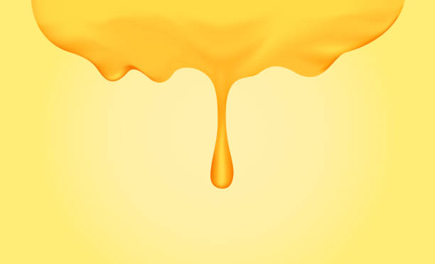 istock honey dripping with honey dipper isolated on yellow gold background, honey liquid drop golden of honeycomb for graphic, honey drip splash flowing from top, syrup sweet and sticky flowing splash drip 1152614630
