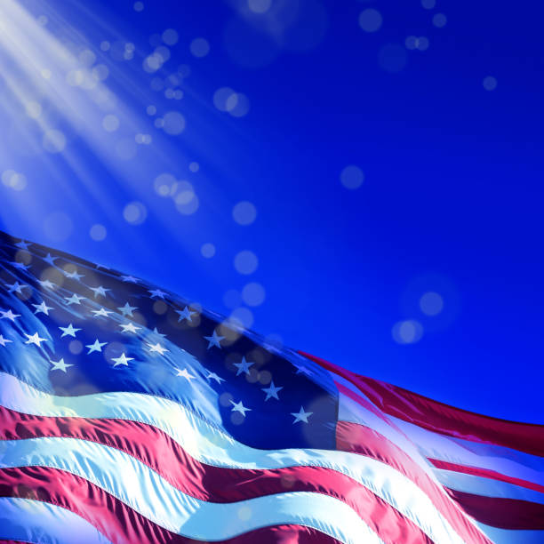 istock close up waving American flag over blue sky 1152617119