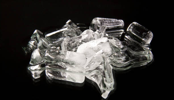 istock Cubes of ice on a black background 1152617621