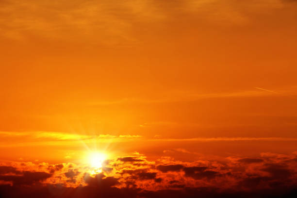 istock background image of orange colored sunset sky with shining sun 1152618855