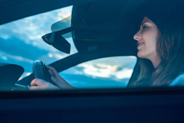 istock Young woman driving a car 1152621189