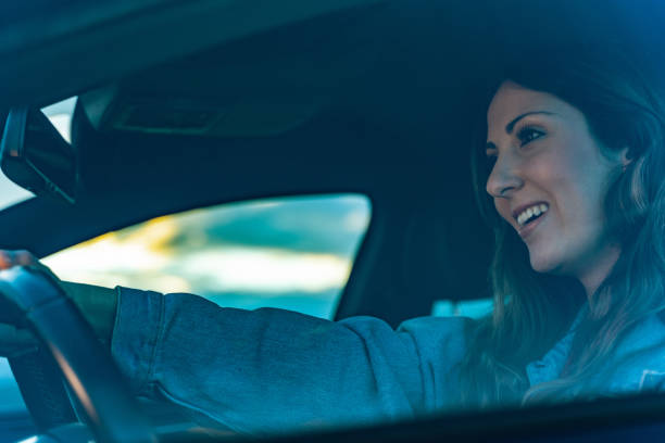 istock Young woman driving a car 1152621197
