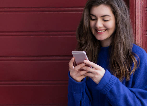 istock Young woman using mobile phone 1152624004