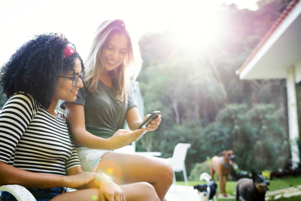istock Good friends spending time together and having fun, looing at cell phone. 1152624150