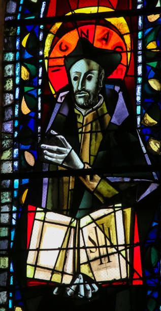 Saint Ignatius of Loyola - Stained Glass in Paris Stained Glass in the Basilica Sacre Coeur in Paris, France, depicting Saint Ignatius of Loyola, founder of the Jesuit Order ncaa college conference team stock pictures, royalty-free photos & images