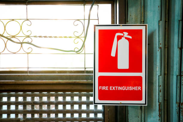 istock Fire extinguisher sign beside the window 1152627537