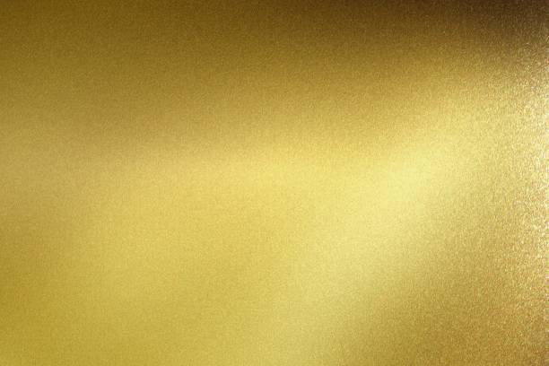 istock Glowing polished golden metal wall, abstract texture background 1152627593
