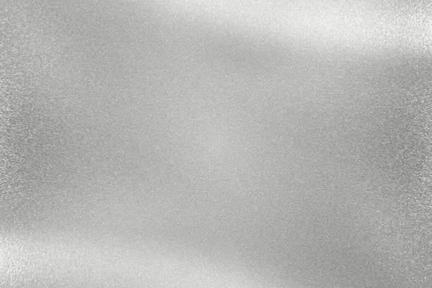 istock Glowing polished silver metal wall, abstract texture background 1152627596