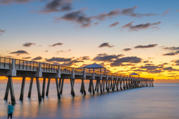 Juno Beach Pier Juno, Florida, USA at the Juno Beach Pier just before sunrise. west palm beach stock pictures, royalty-free photos & images