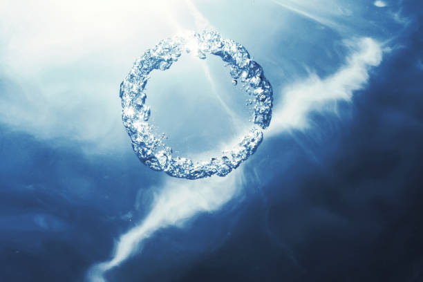 istock Bubble ring Underwater ascends towards the sun. 1152631635