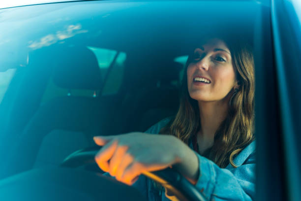 istock Young woman driving a car 1152633216