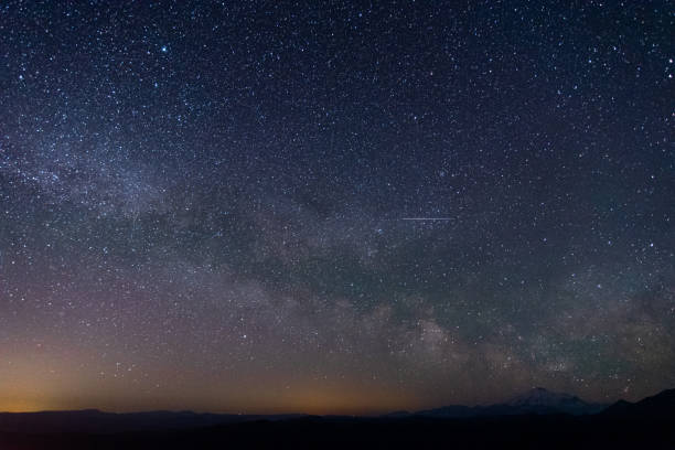 istock night sky with milky way over the mountains 1152635654