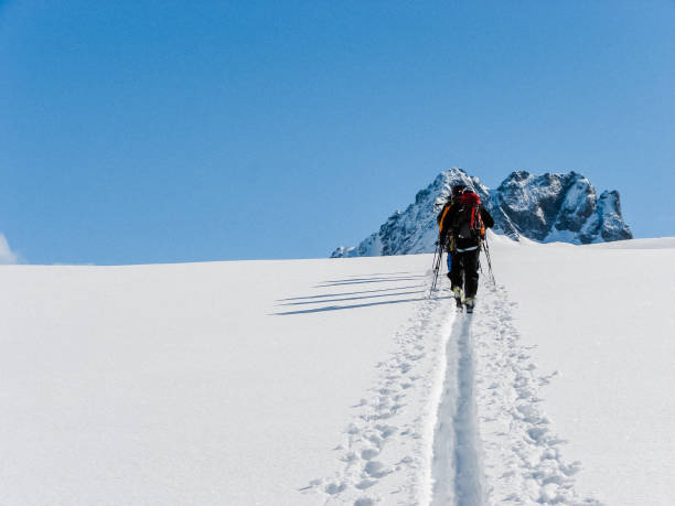 istock Winter mountain adventure. Man on a trail 1152636528