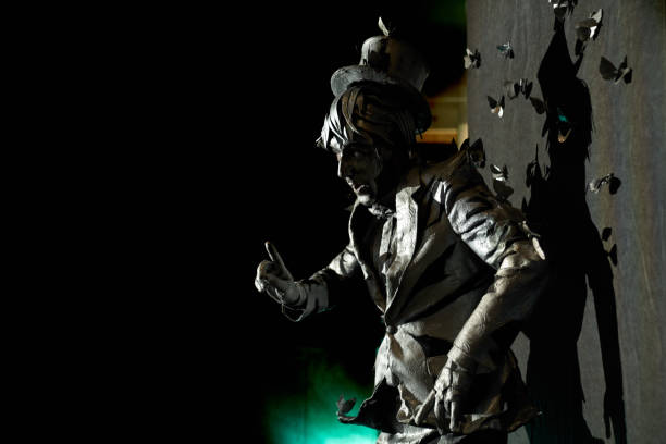 istock Side view of professional mime dressed like bronze statue 1152637252