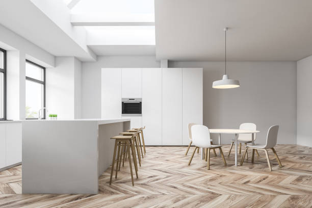 istock Side view of white kitchen with bar and table 1152638544