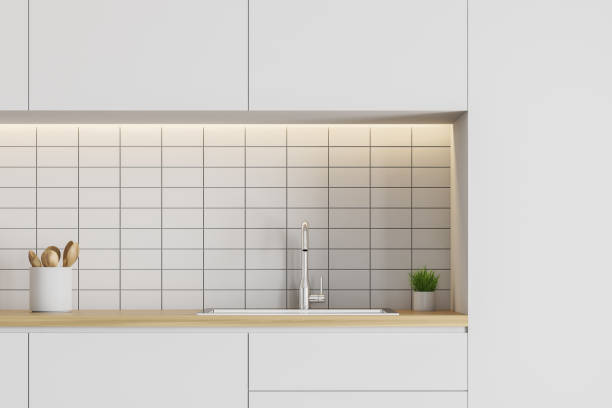 istock Close up of white kitchen countertop with sink 1152638694