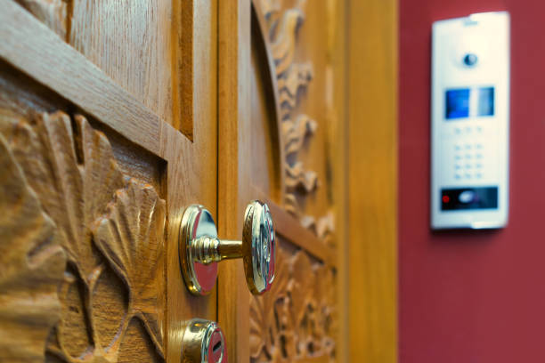 istock Wooden door with modern intercom 1152640027