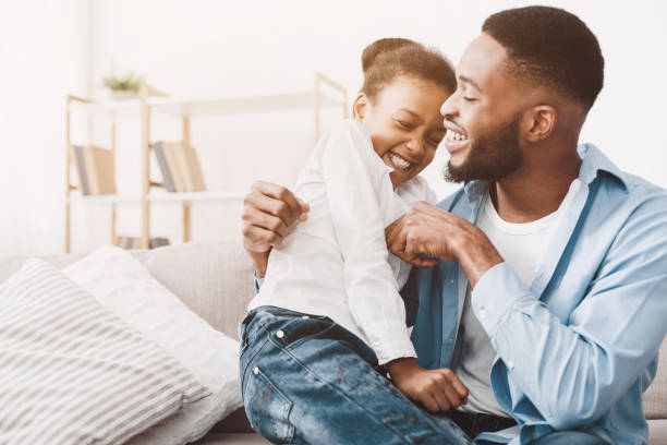 istock Father and daughter playing together at home 1152640418