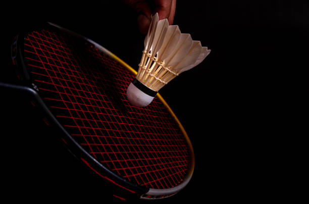 istock The still life badminton shuttlecock feather professional and racket on isolated black background. 1152640603