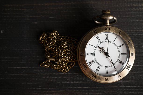 istock Antique pocket watch Placed on a black wooden background. copy space for text 1152640833