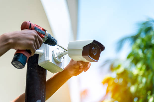 istock A Wireless CCTV camera setting outside building with white box water poof with sun blur background. 1152641792