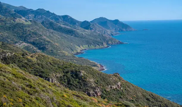 Photo of Spectacular landscapes, awe-inspiring cliffs, charming villages and historical landmarks along the coastal road between Alghero and Bossa, Sardinia, Italy. One of the most panoramic spots in Italy.