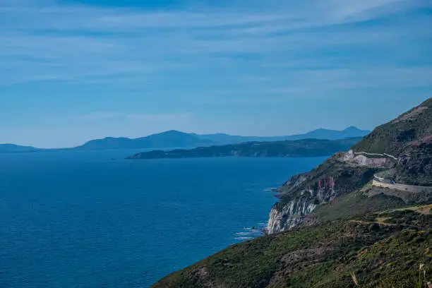 Photo of Spectacular landscapes, awe-inspiring cliffs, charming villages and historical landmarks along the coastal road between Alghero and Bossa, Sardinia, Italy. One of the most panoramic spots in Italy.