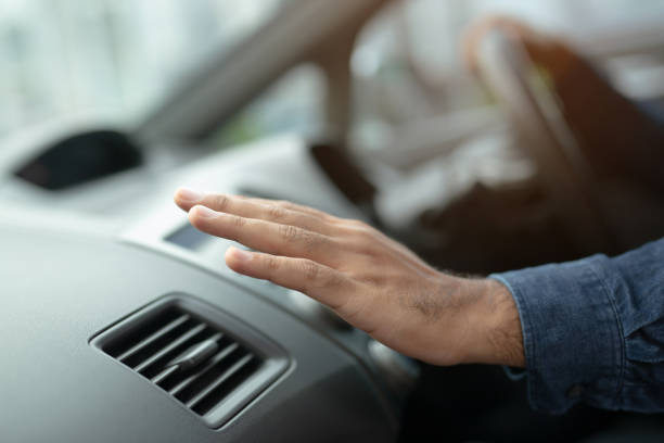 istock Closeup of hand driver man checking adjusting air from conditioning the cooling system with flow of cold air in car. Leave space for writing text. 1152644013