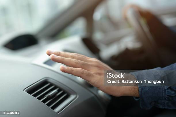 Closeup Of Hand Driver Man Checking Adjusting Air From Conditioning The Cooling System With Flow Of Cold Air In Car Leave Space For Writing Text Stock Photo - Download Image Now