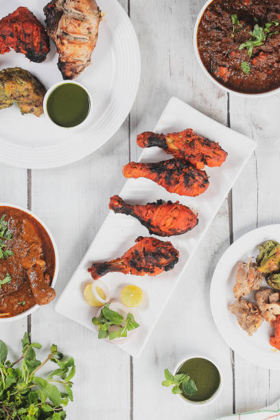 Roasted chicken legs and wings on platter