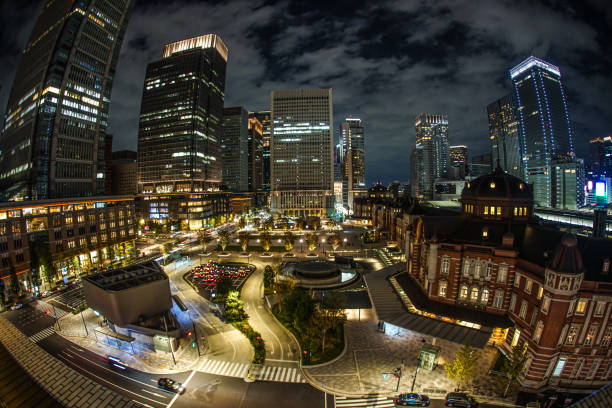 tokyo station and the business district which is visible from kitte - tokyo station railroad station chiyoda ward building exterior imagens e fotografias de stock