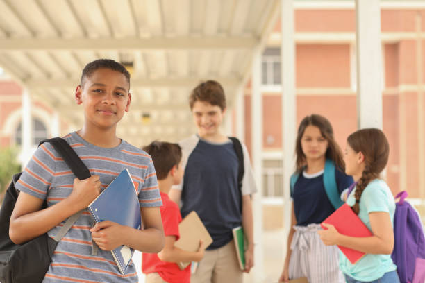 istock African descent, junior high age boy on school campus. 1152647442