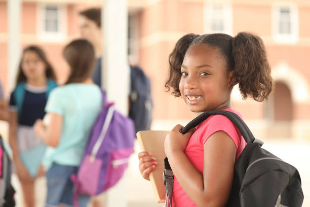 istock African descent, elementary age girl on school campus. 1152647641