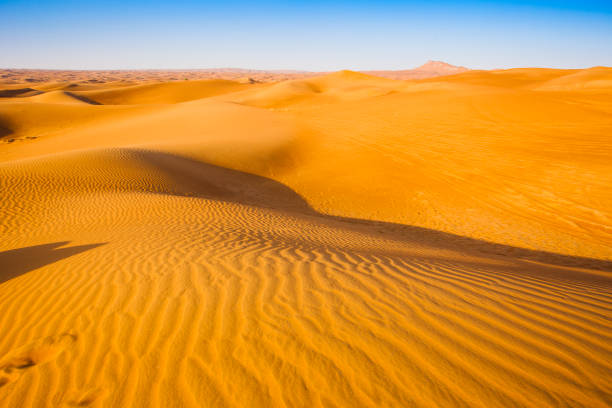 istock desert sand and dunes with clear blue sky 1152647760