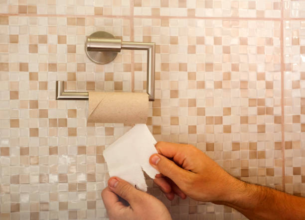 istock hands with torn toilet paper 1152647799