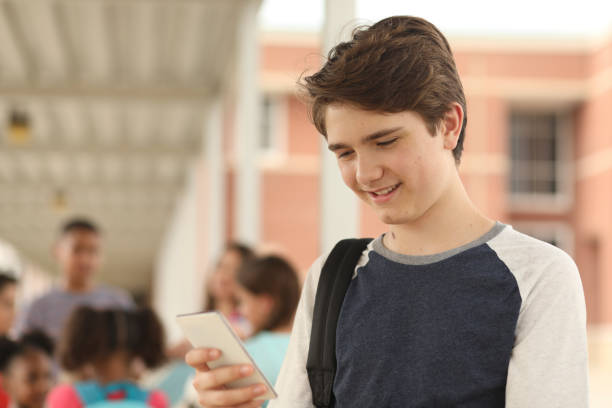 istock Latin descent, junior high age boy on school campus. 1152649739