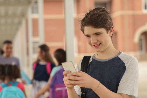 istock Latin descent, junior high age boy on school campus. 1152649806