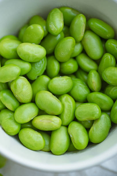 istock Macro image of edamame beans on bowl on a table 1152650652