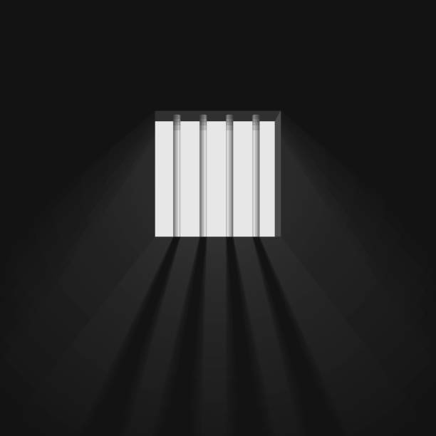 istock Prison room window with bars. The sun's rays make their way through the window. Jail cell interior. 1152651939