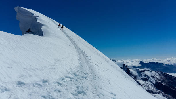 istock Climbers' silhouettes. Majestic mountain landscape 1152653198