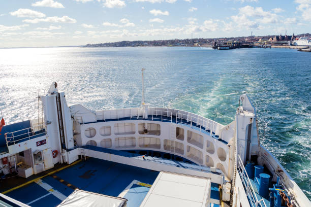 View over board of passenger ferry between Denmark and Sweden over blue sea and waves. Scandinavia cruise travel concept. stock photo